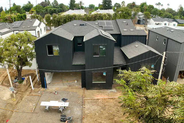 New SB 9 homes in Northridge with board-and-batten siding, shingle roofs and solar panels