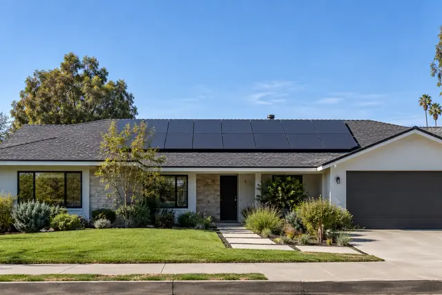 AI-generated illustration: new dark roof with neatly aligned solar panels on a ranch home