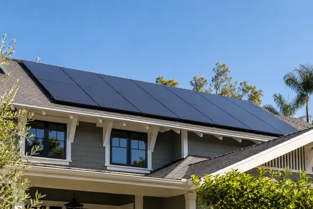 AI-generated illustration: black solar panels on a Craftsman shingle roof